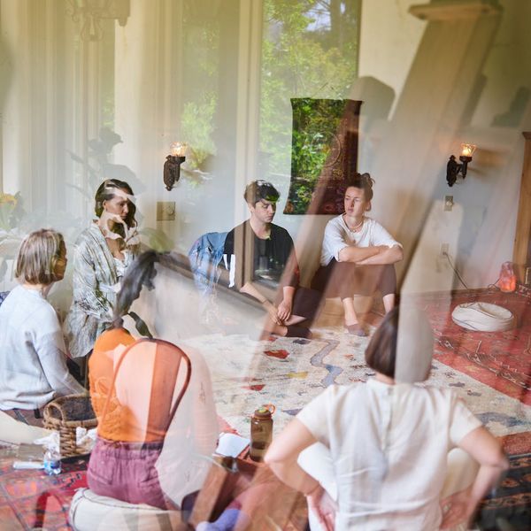 Group of diverse people sitting in a calm meditation circle.